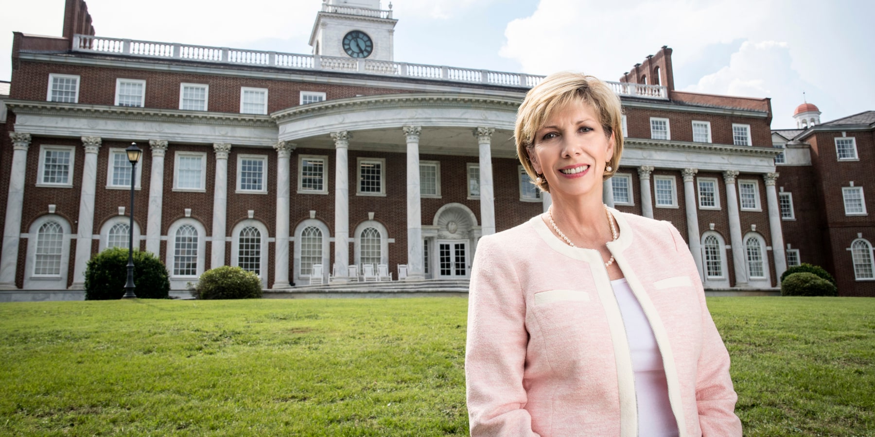 Cathy Mercer in a light pink cardigan.